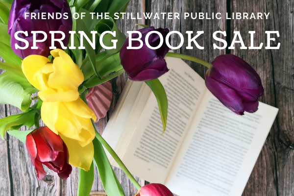 Multi-colored tulips on an open book with text of Friends of the Stillwater Public Library Spring Book Sale